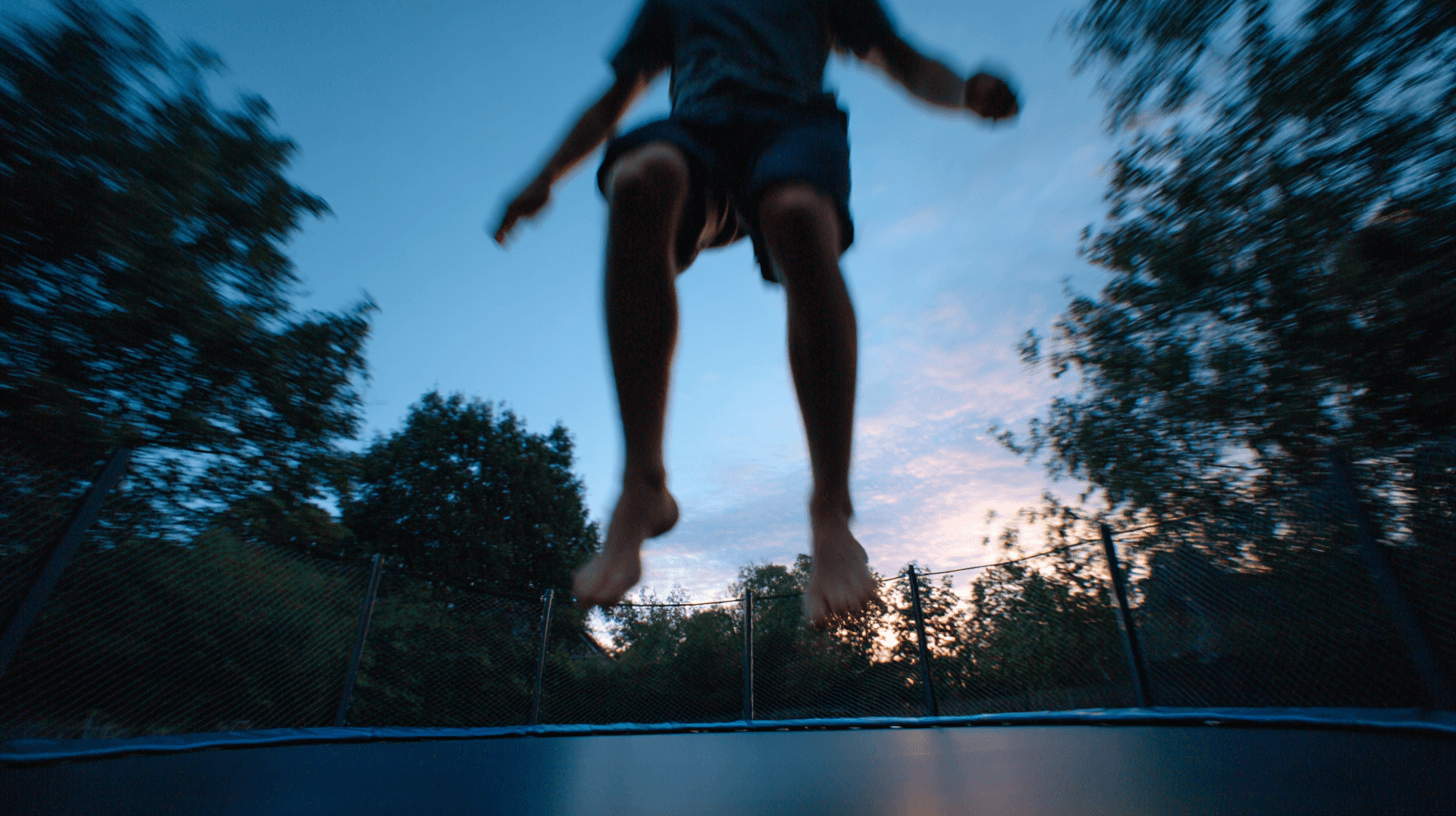 Adults hiking on a wooded trail laughing together — adult play boosts mental health, reduces stress, and improves brain function